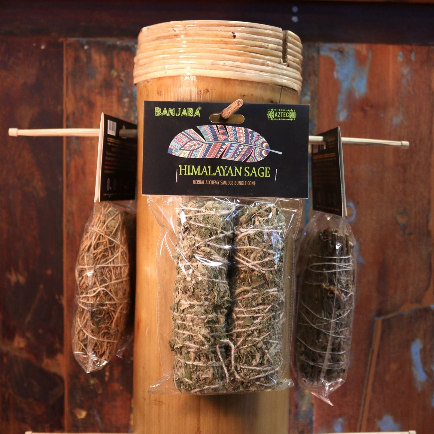 Sage smudge stick on a stone platform with a dark background