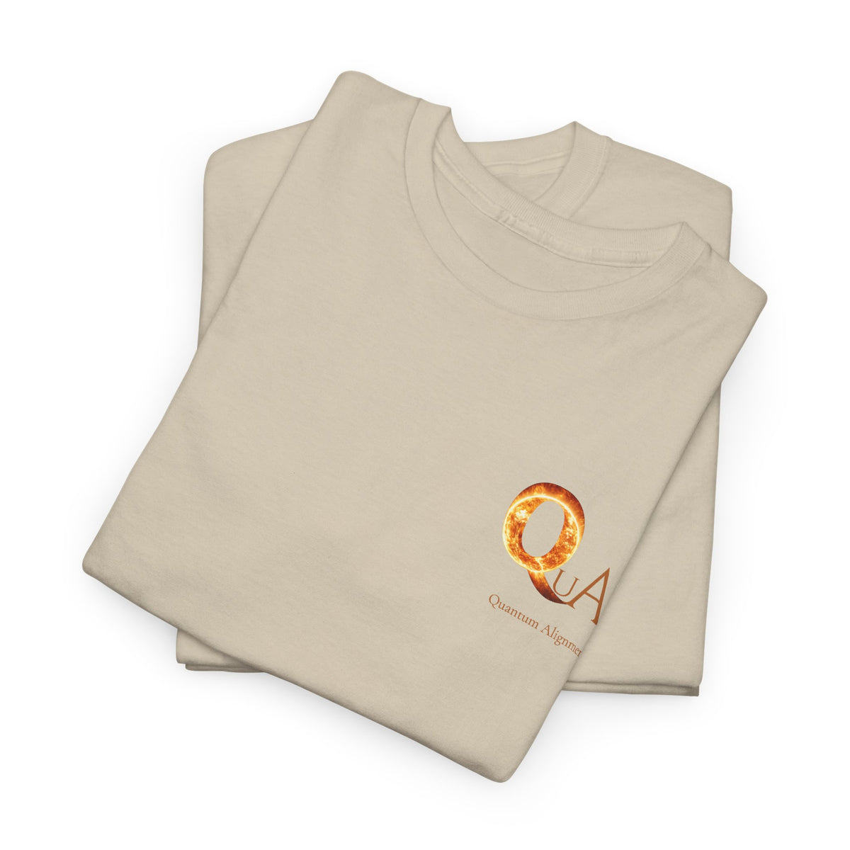 A folded beige t-shirt with a small circular orange and gold graphic logo on the left chest reading 'QuUA Quantum Alignment', shown on a clean white background.
