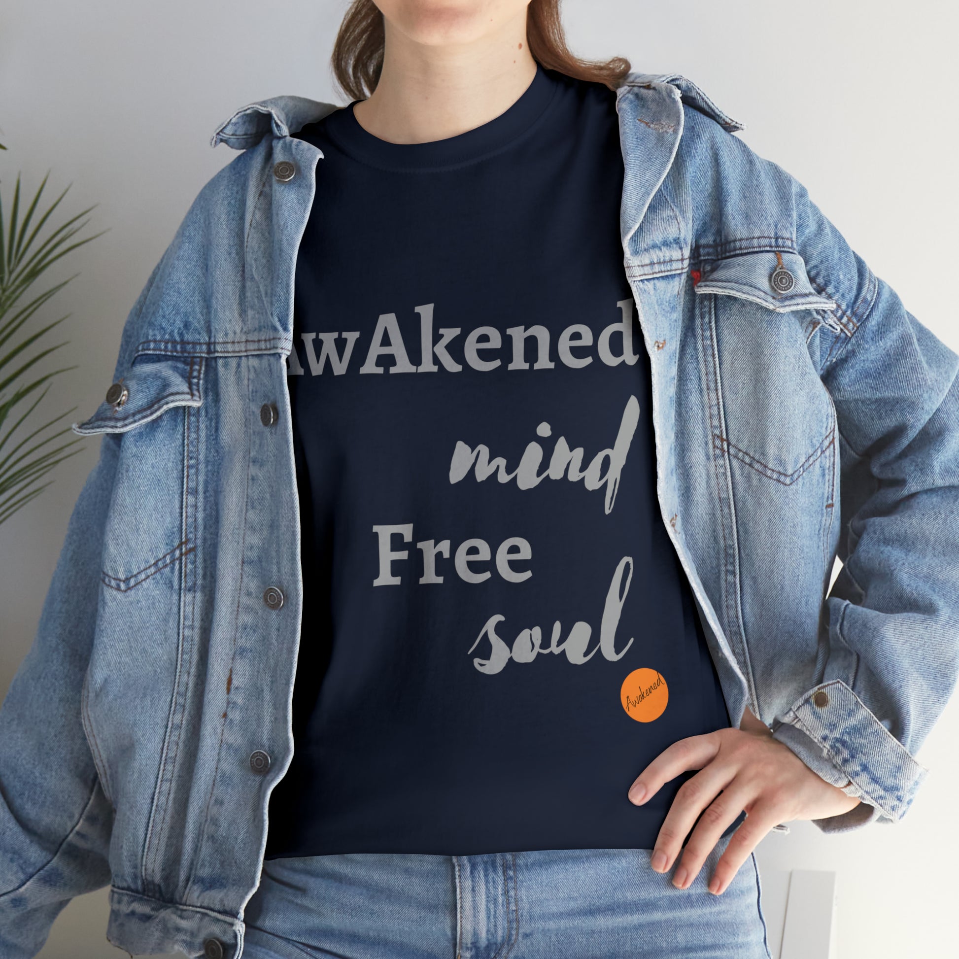 Woman wearing a dark blue T-shirt with the print, awakened mind free soul