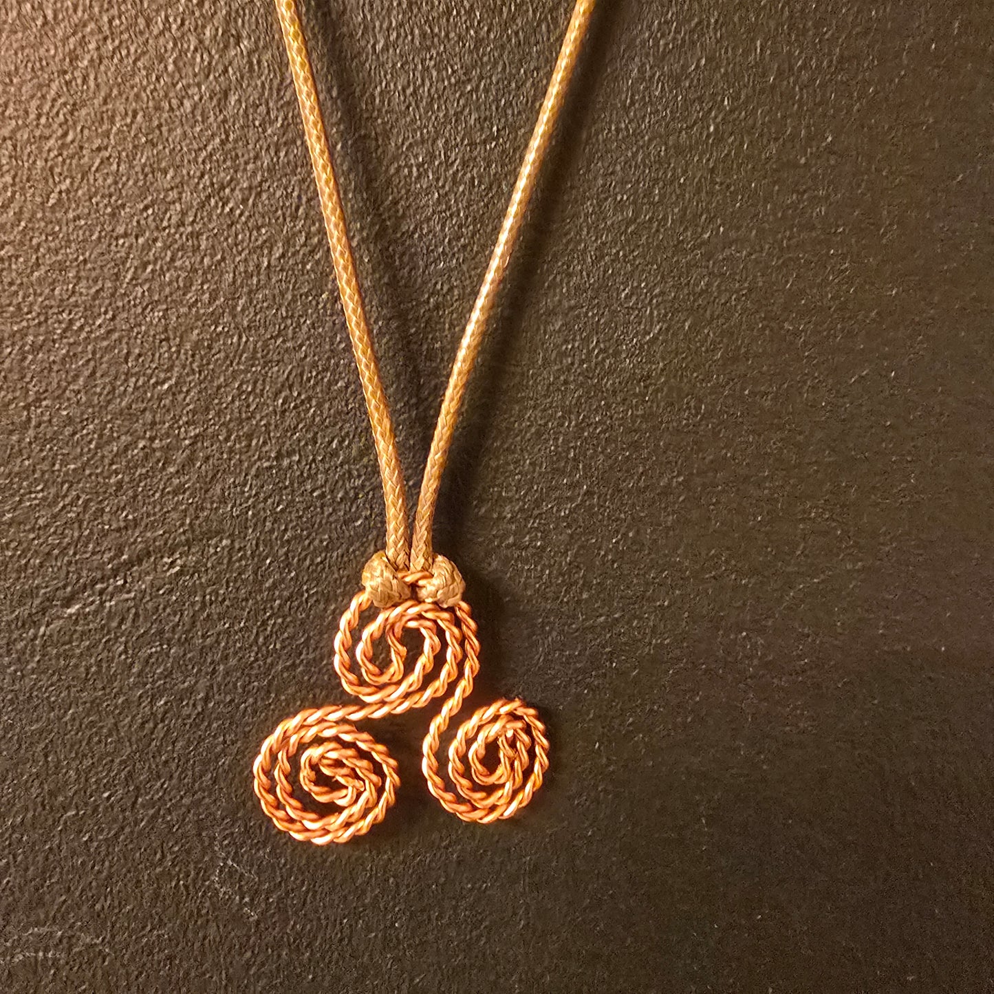 triskelion necklace with olive green cord