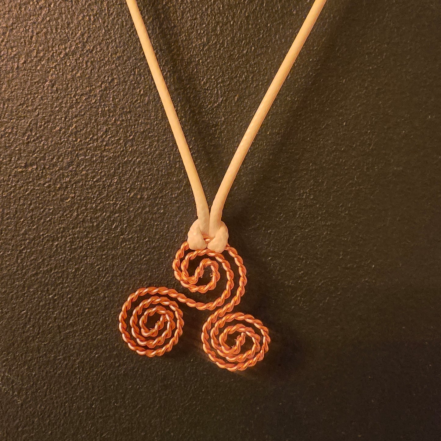 triskelion necklace with cream cord